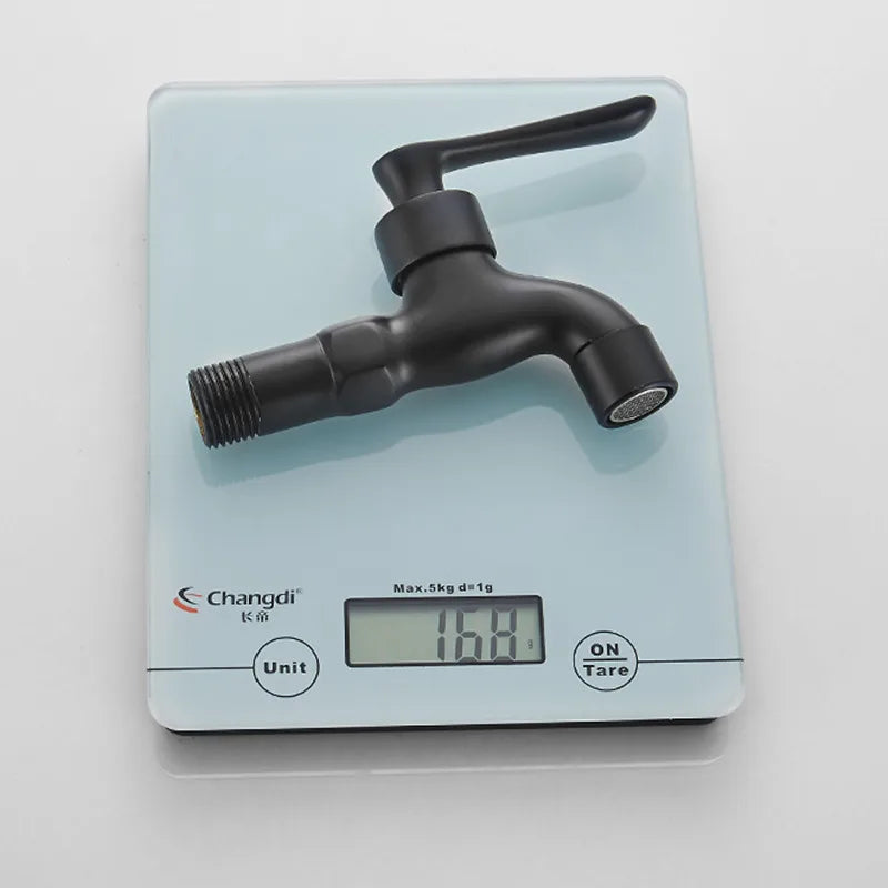 Black faucet on a digital kitchen scale with visible brand name.