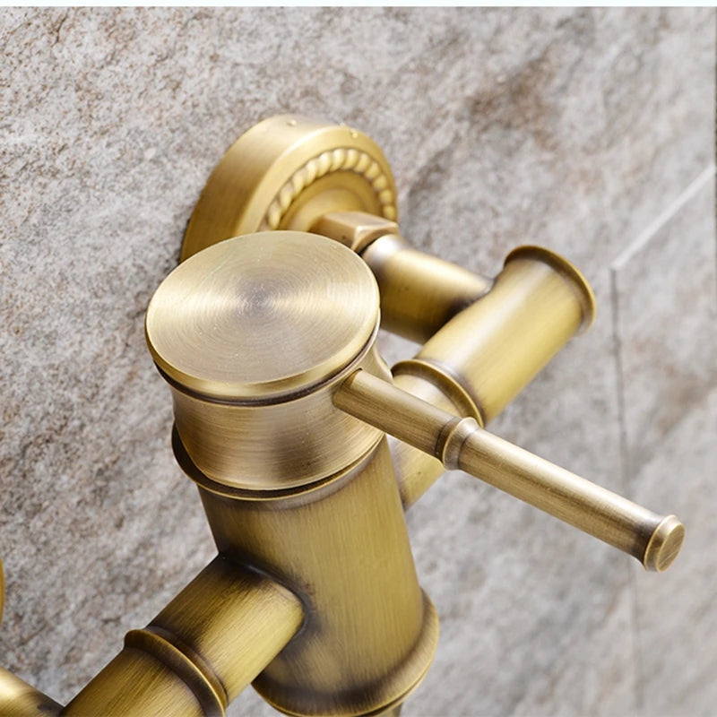 Brass faucet on a marble wall
