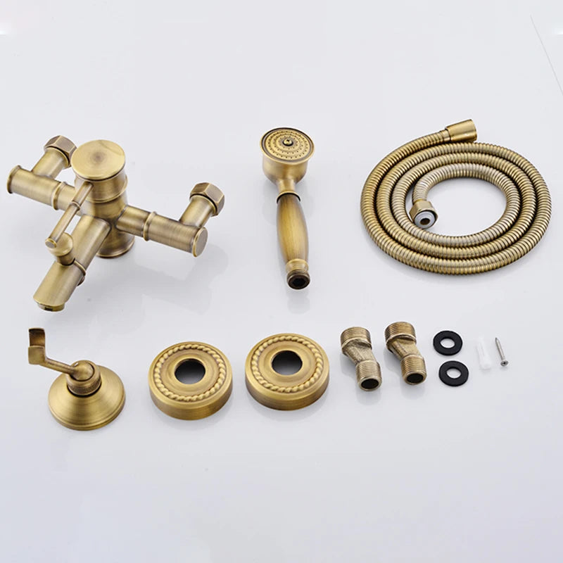 Collection of brass bathroom fixtures including a faucet, handles, and hose on a white background