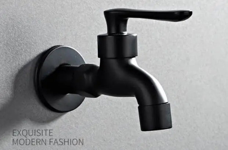 Black wall-mounted faucet on a gray background