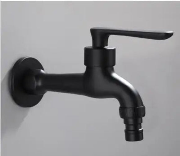Black faucet mounted on a gray wall