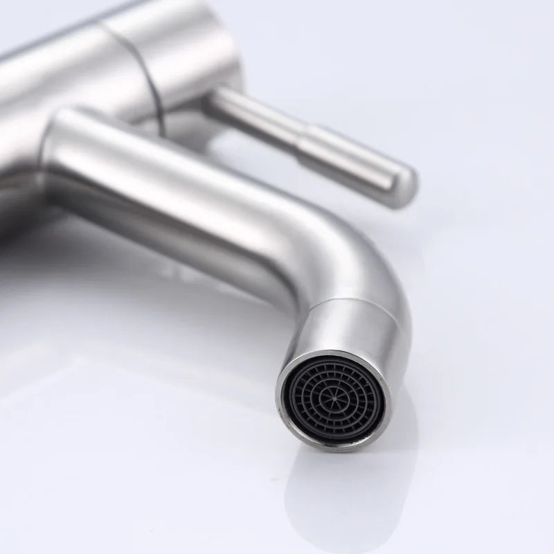 Close-up of a modern kitchen faucet on a white background