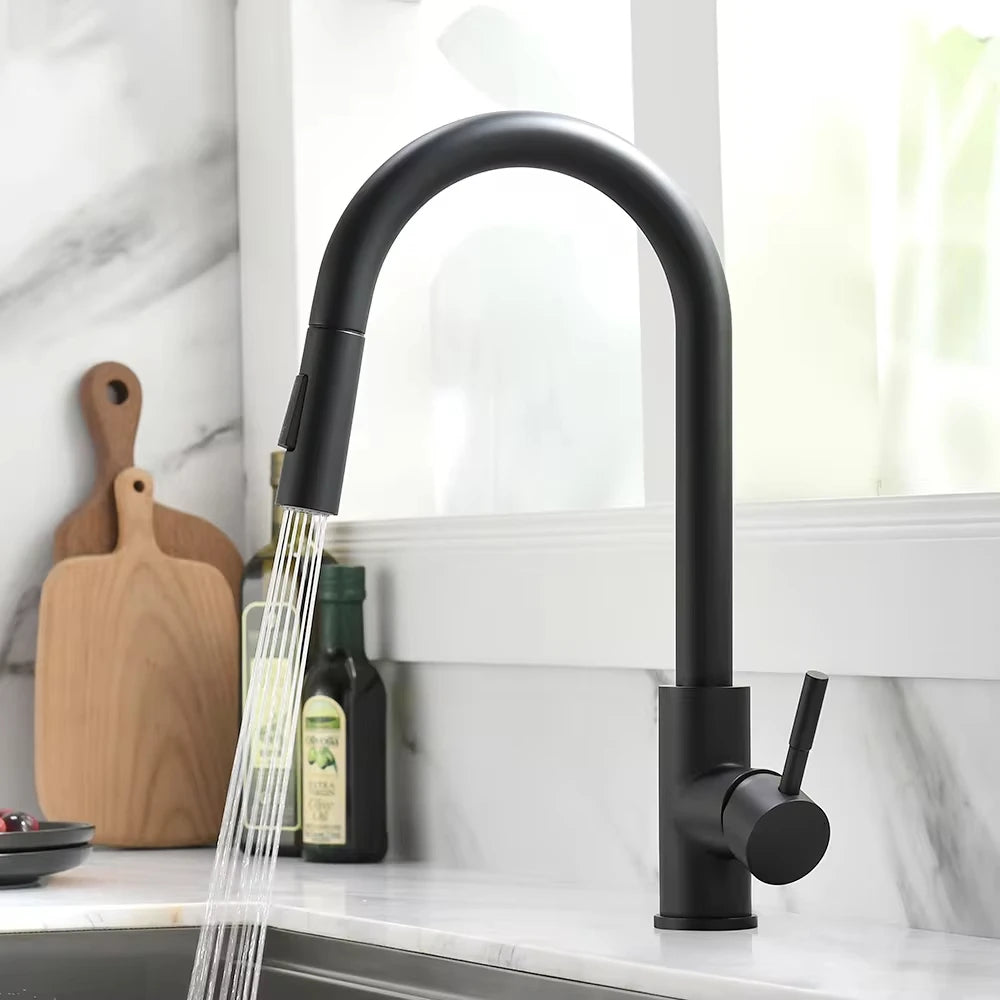 Black kitchen faucet with water flowing in a kitchen setting