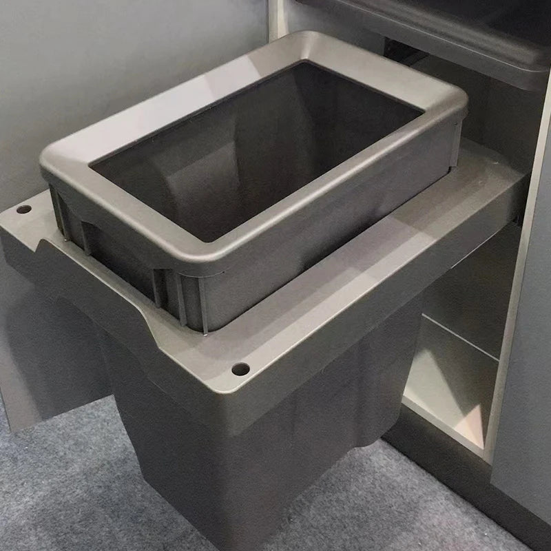 Grey storage bin attached to a wall-mounted shelf