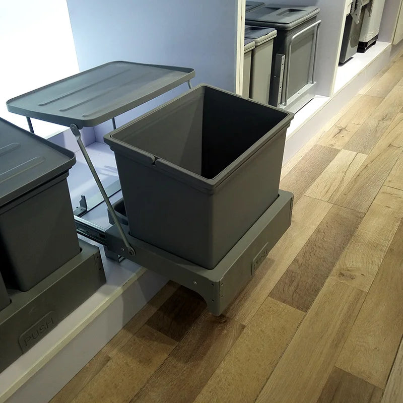 Gray storage bins with lids on a wooden floor