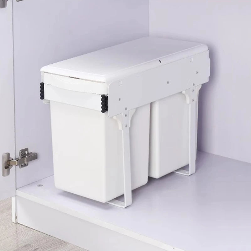 White laundry basket with lid attached to a cabinet in a minimalistic setting