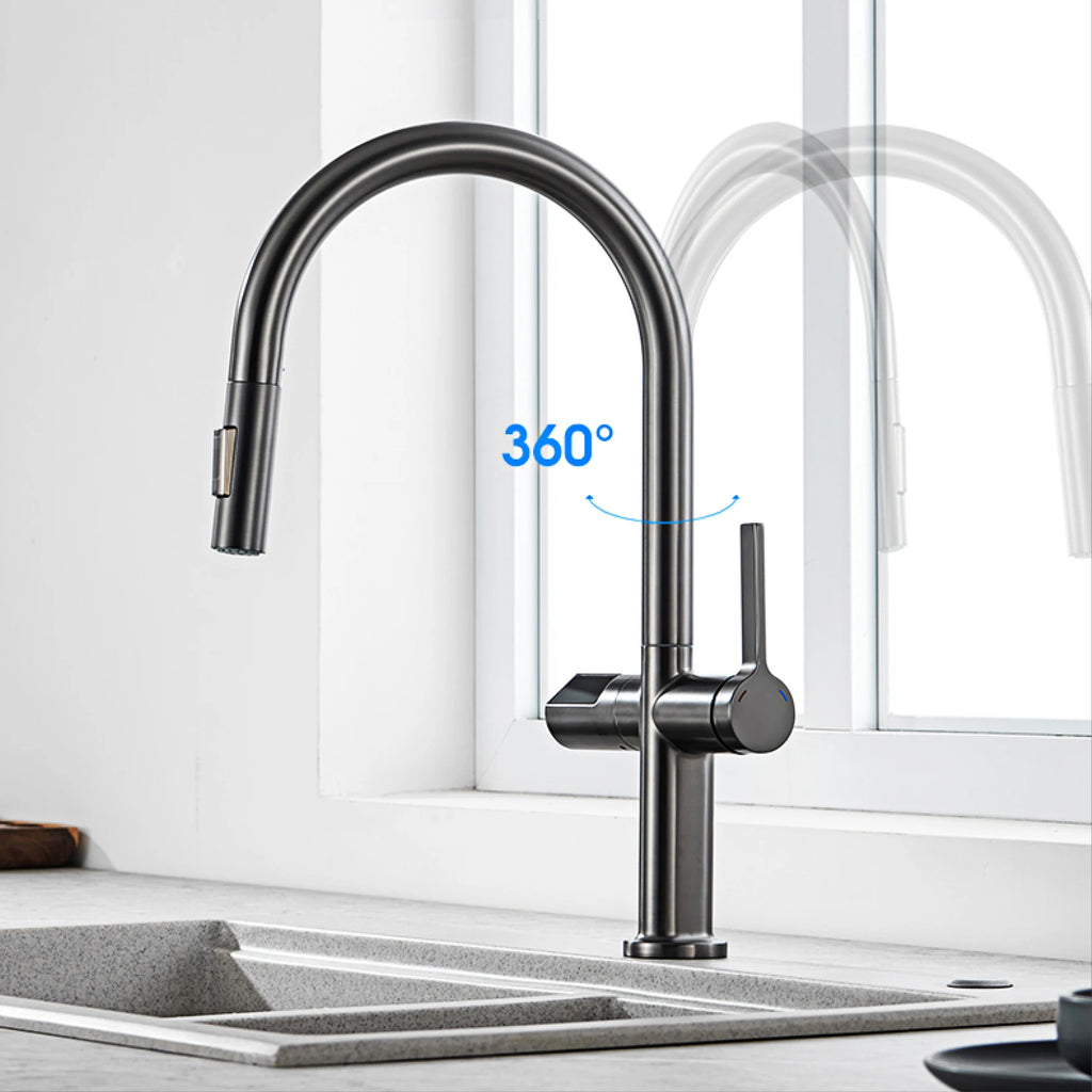 A matte black high-arc pull-down kitchen faucet installed over a gray double-bowl sink, with a bright white window behind it and a blue '360°' graphic indicating swivel range.