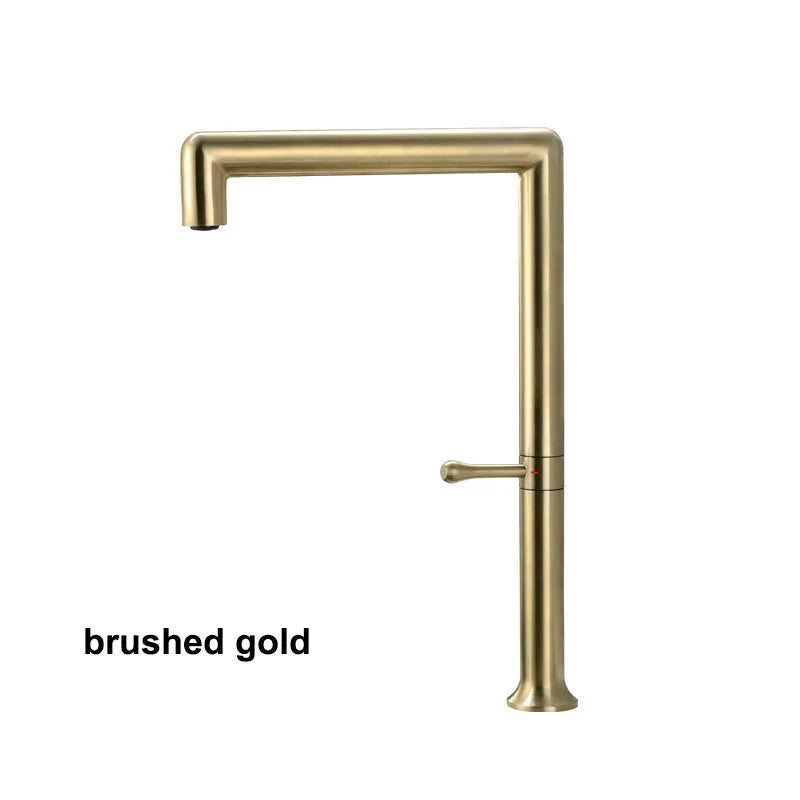 Gold kitchen faucet on a white background