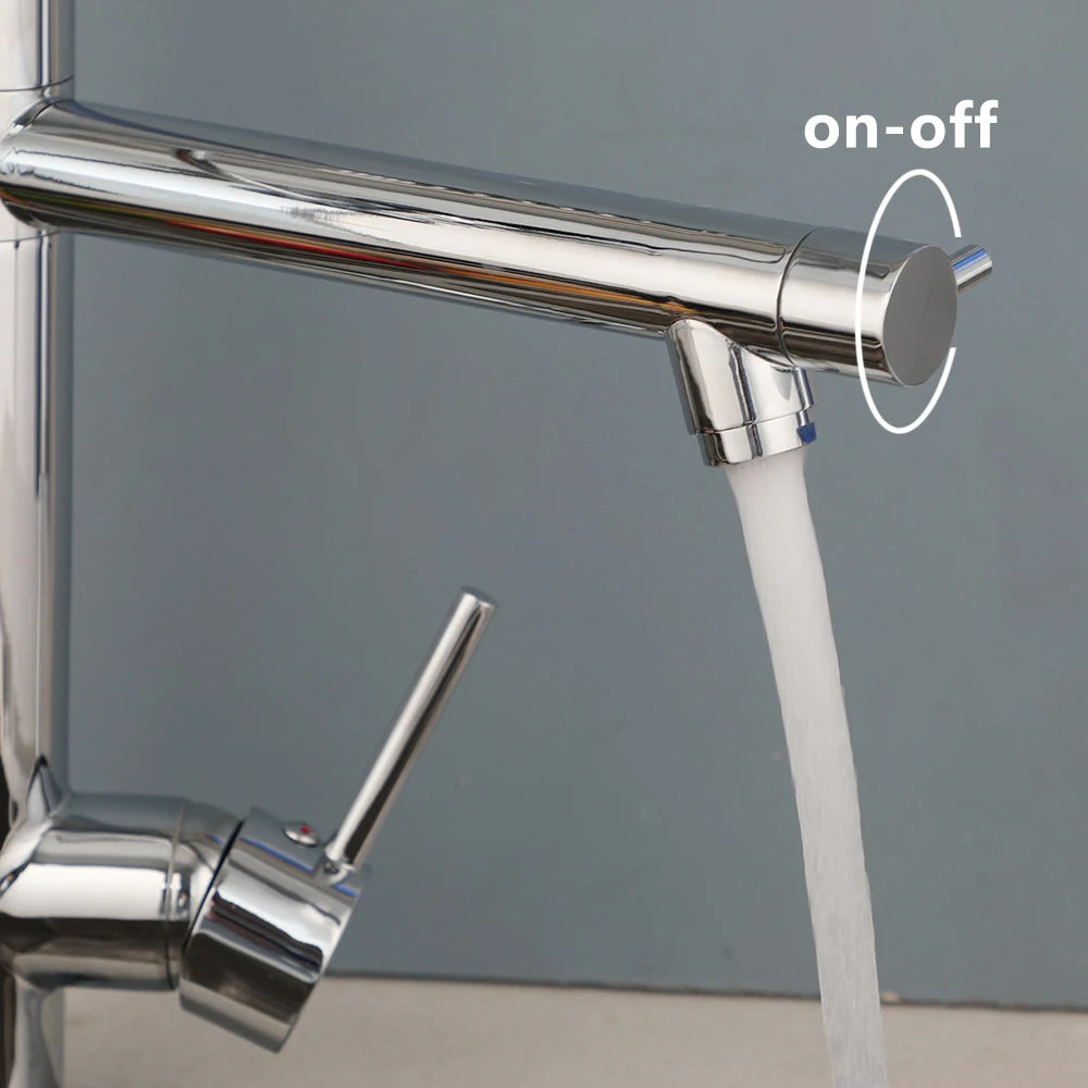 Close-up of a polished chrome kitchen faucet with water running from the spout and an on-off lever highlighted on the right, against a muted blue-gray background.