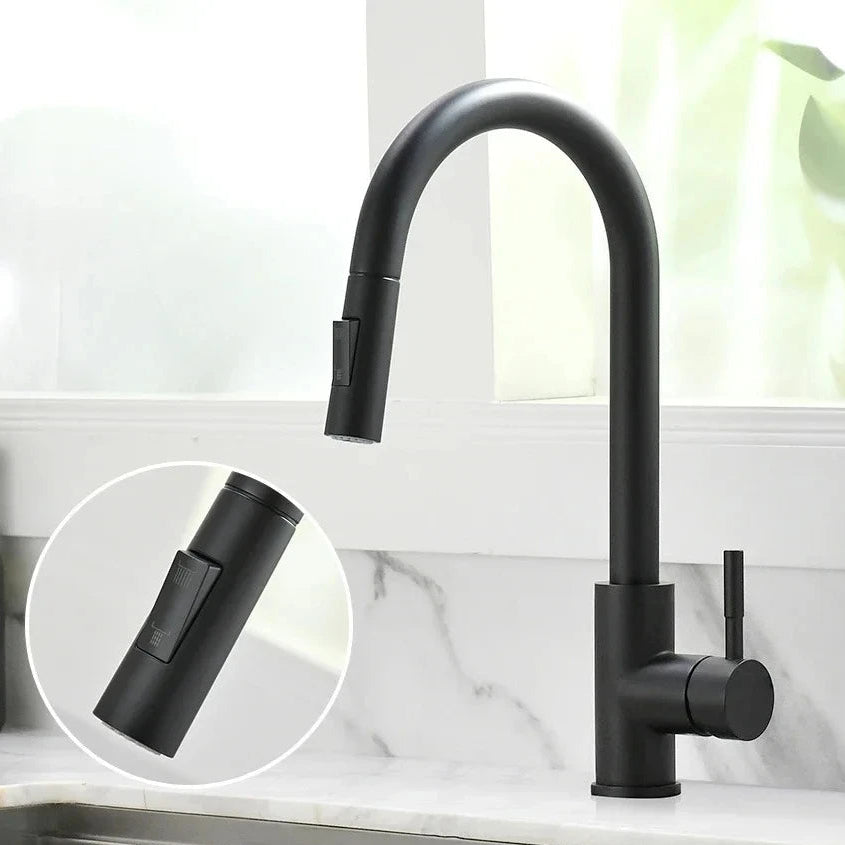 A matte black gooseneck kitchen faucet with a pull-out spout and single handle, shown installed on a white marble sink. A circular inset highlights the pull-out head.