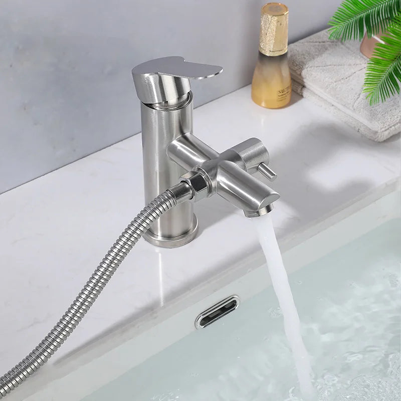 Bathroom faucet with handheld shower head on a sink