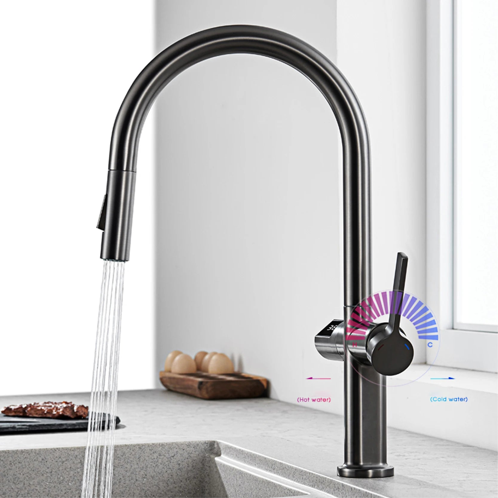 A matte black high-arc pull-down kitchen faucet with running water, shown installed on a countertop in a bright kitchen setting. A small water-flow indicator graphic is overlaid near the handle.