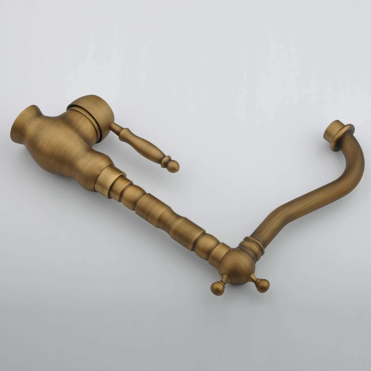 Bronze door handle on a light gray background