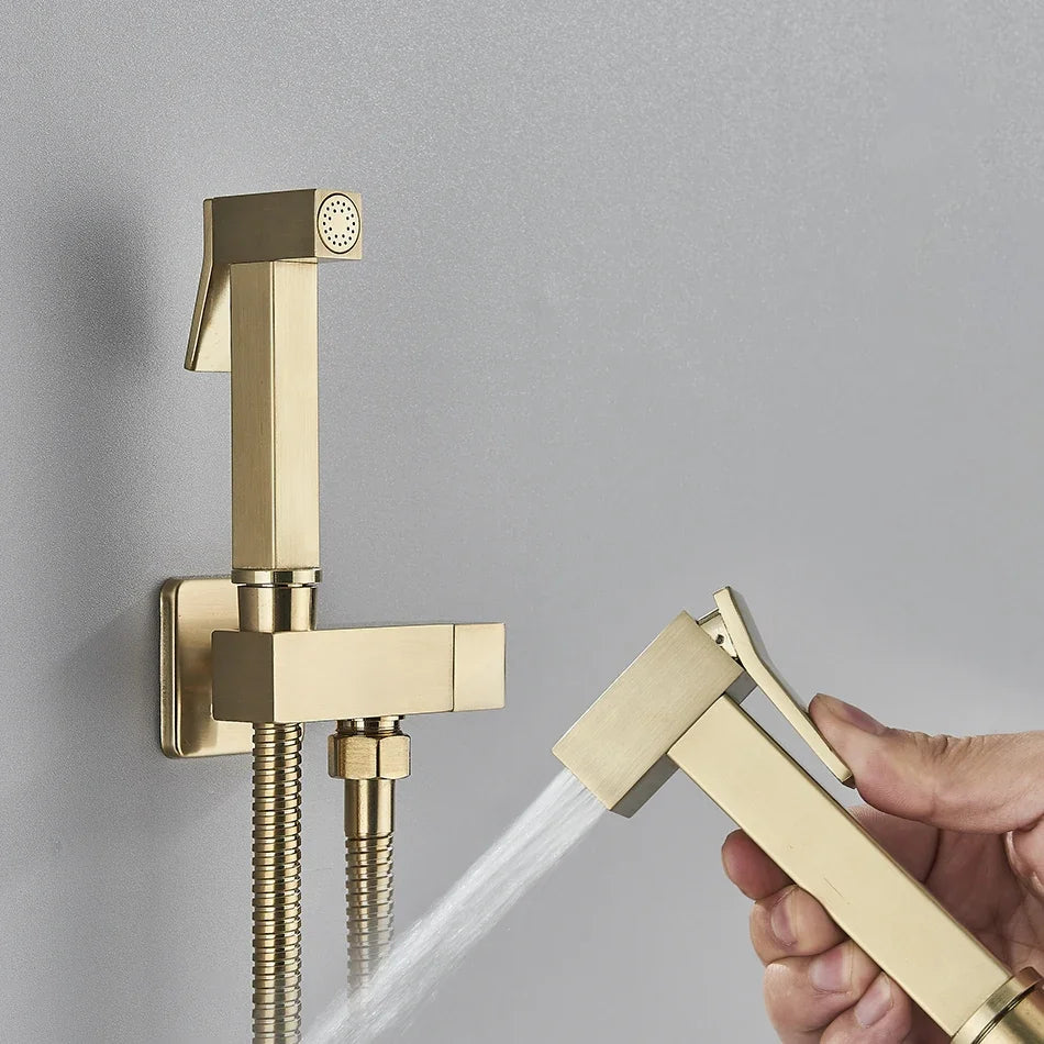 Gold shower head and handheld shower being used on a gray background