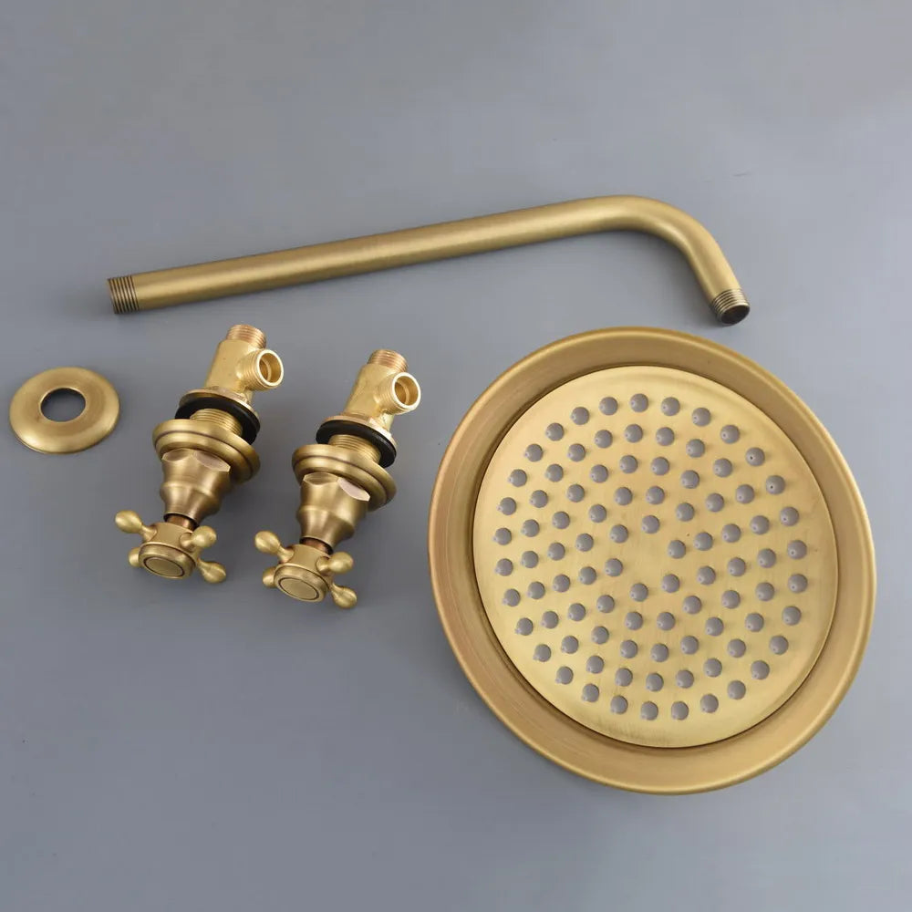Set of gold-colored shower components on a gray background