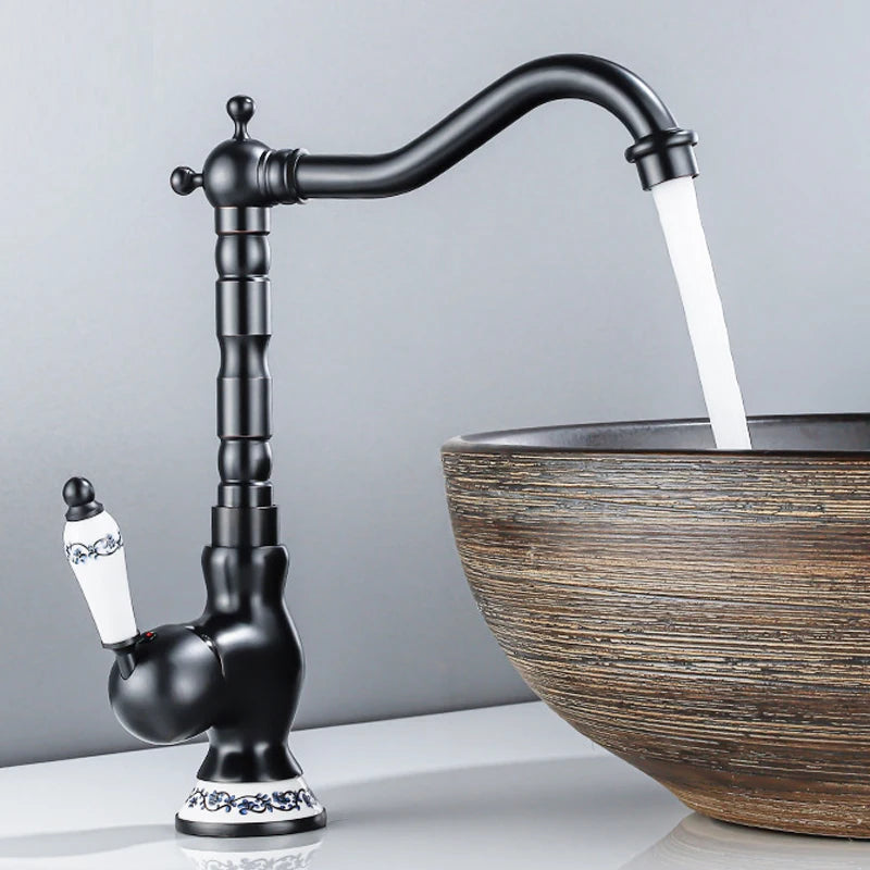 Traditional Black faucet with water flowing into a wooden sink basin on a grey background