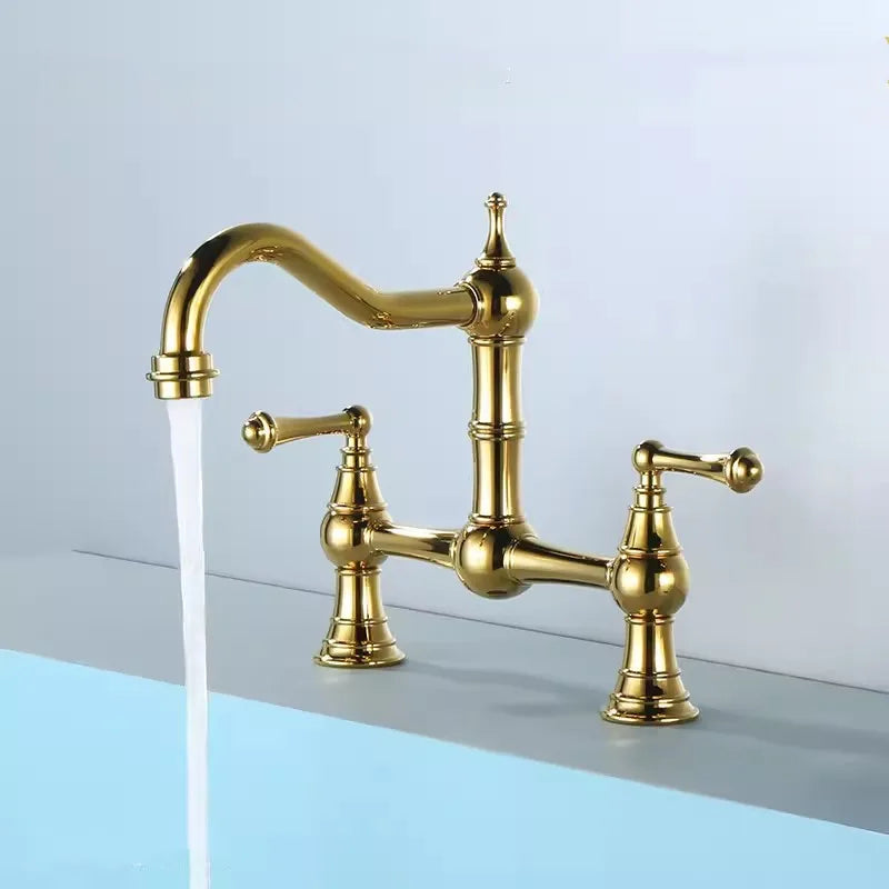 Gold kitchen faucet on a light blue and gray background