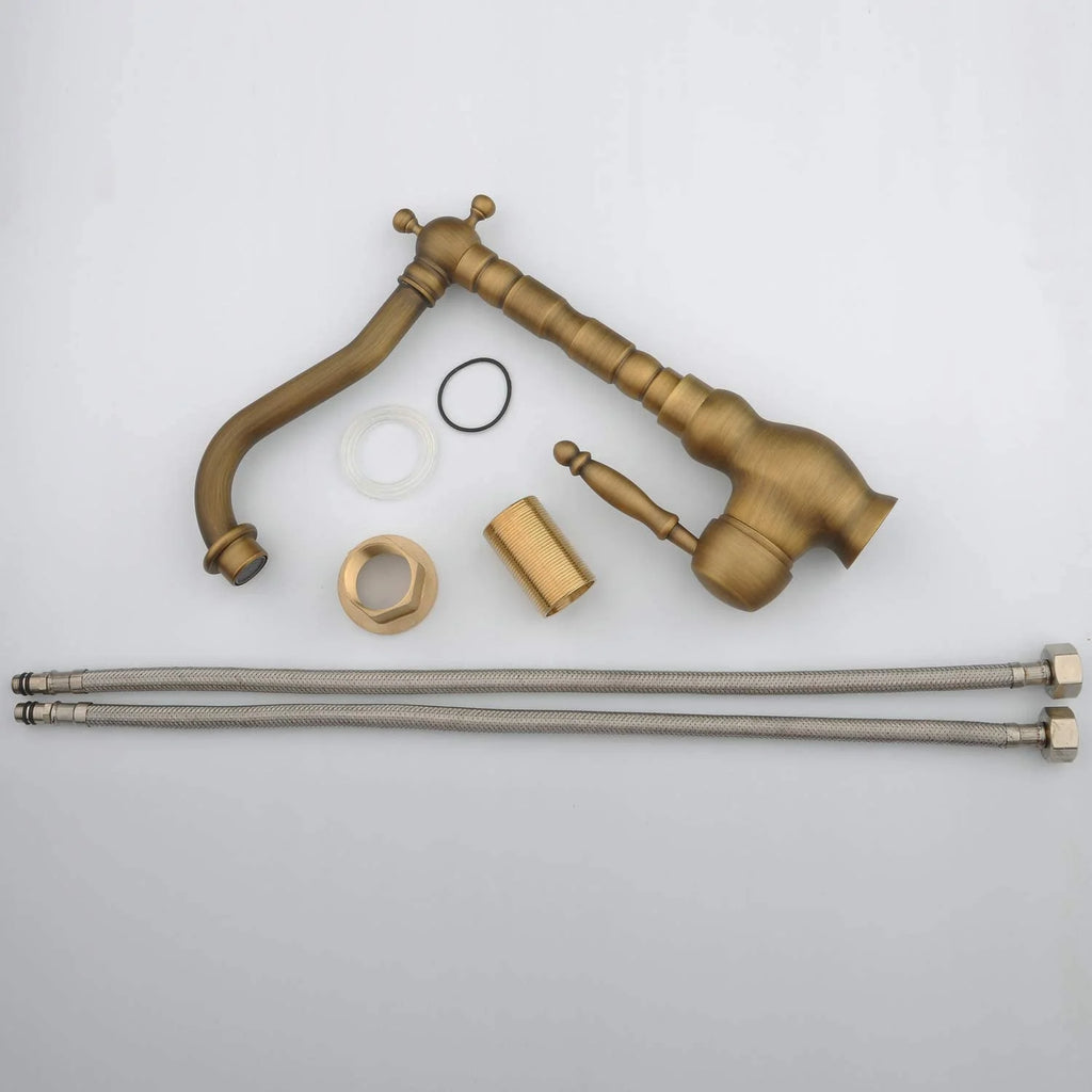 Collection of brass plumbing fixtures and parts on a white background